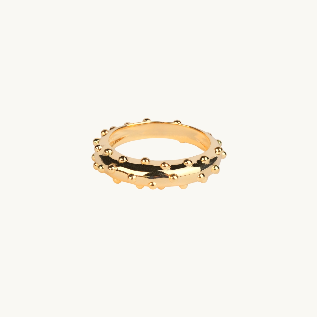 A highly polised gold ring with small dots
