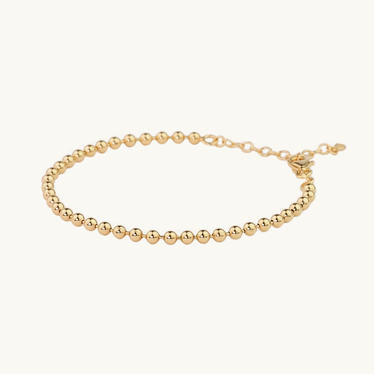 Globe bracelet in gold plated brass
