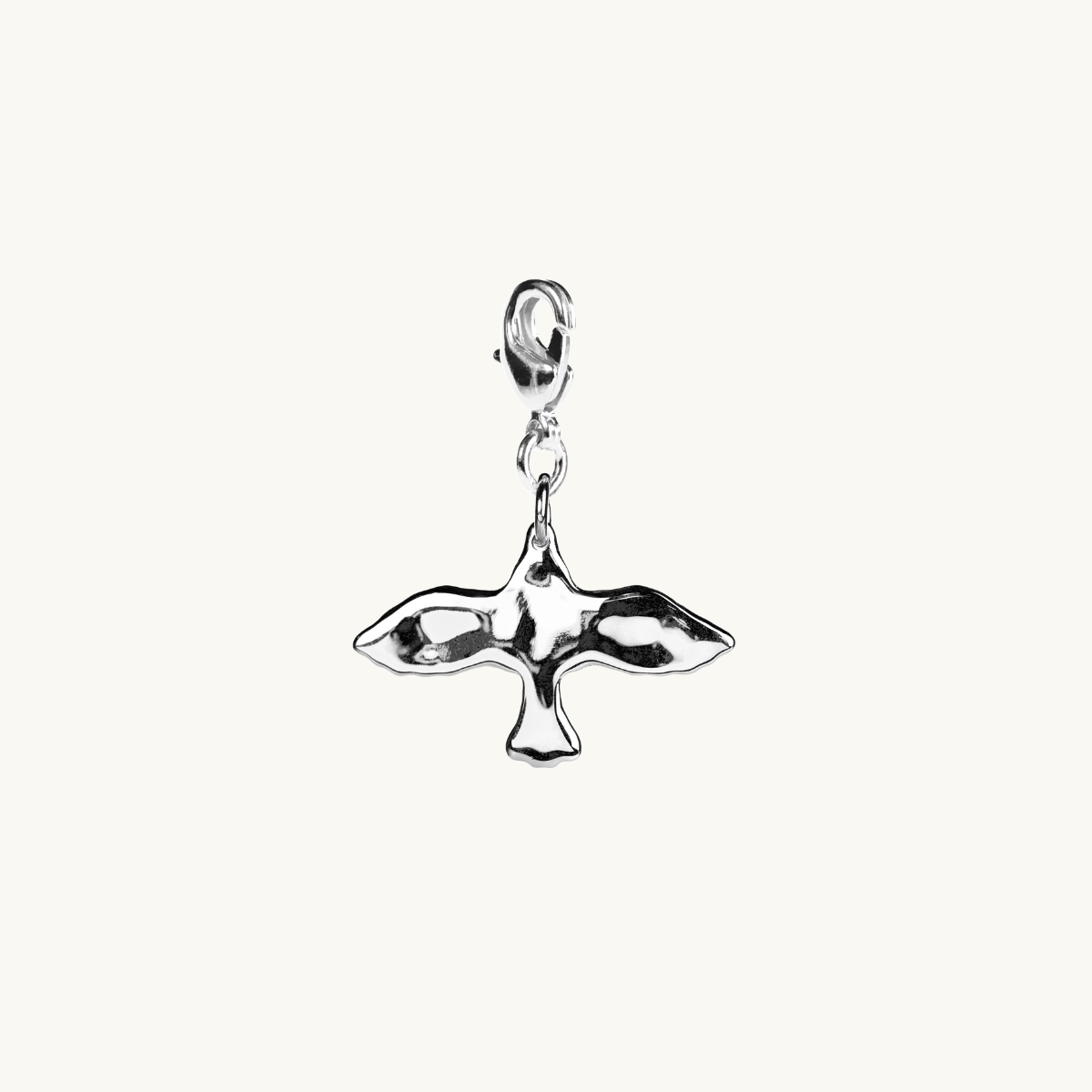 Uneven dove charm in sterling silver