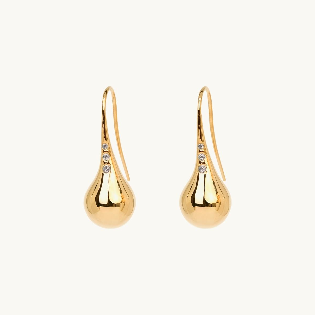 Drop shaped earrings in gold with white stones