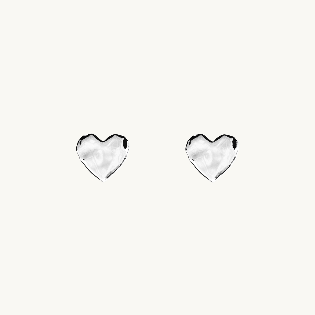 Pin earrings in silver in shape of a heart with an organic shape