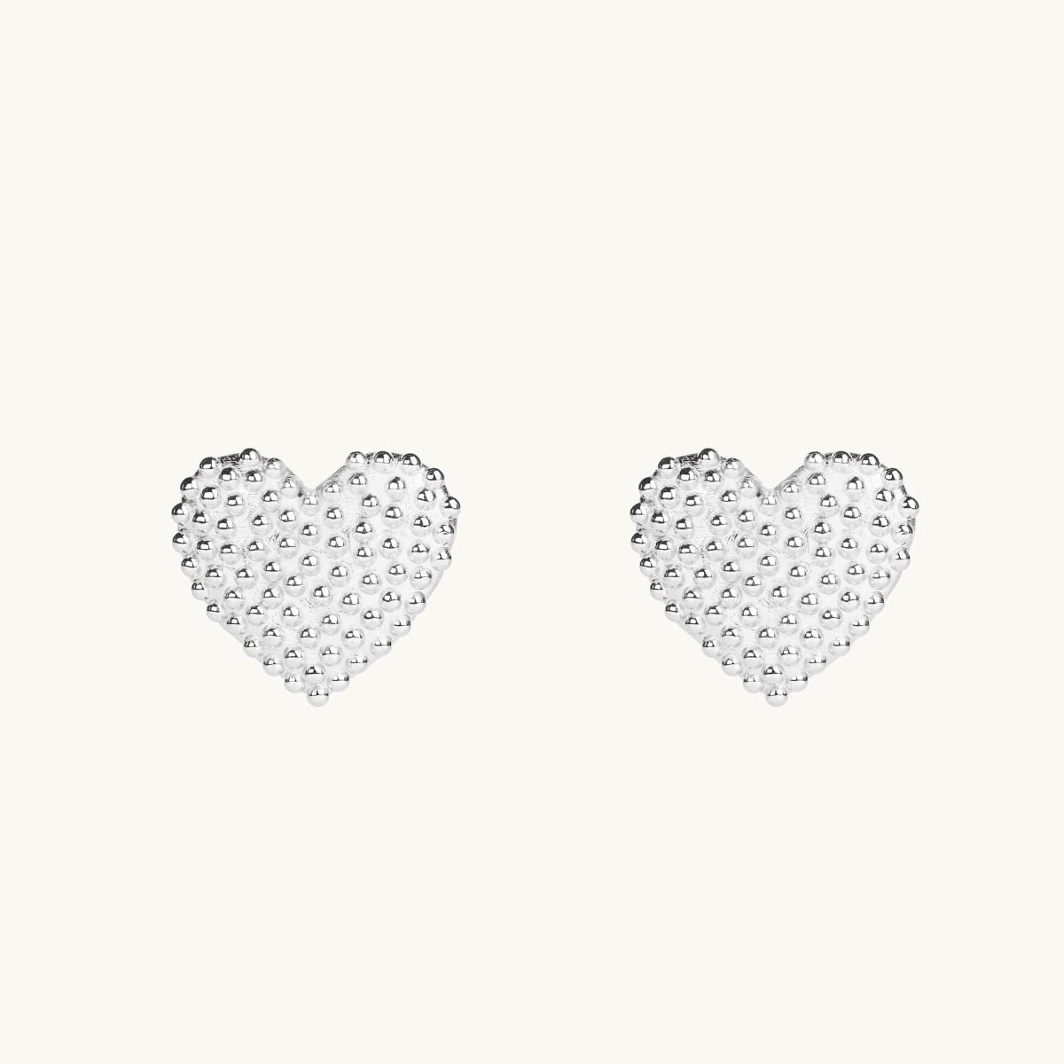 Dew drops on heart earrings in sterling silver. 