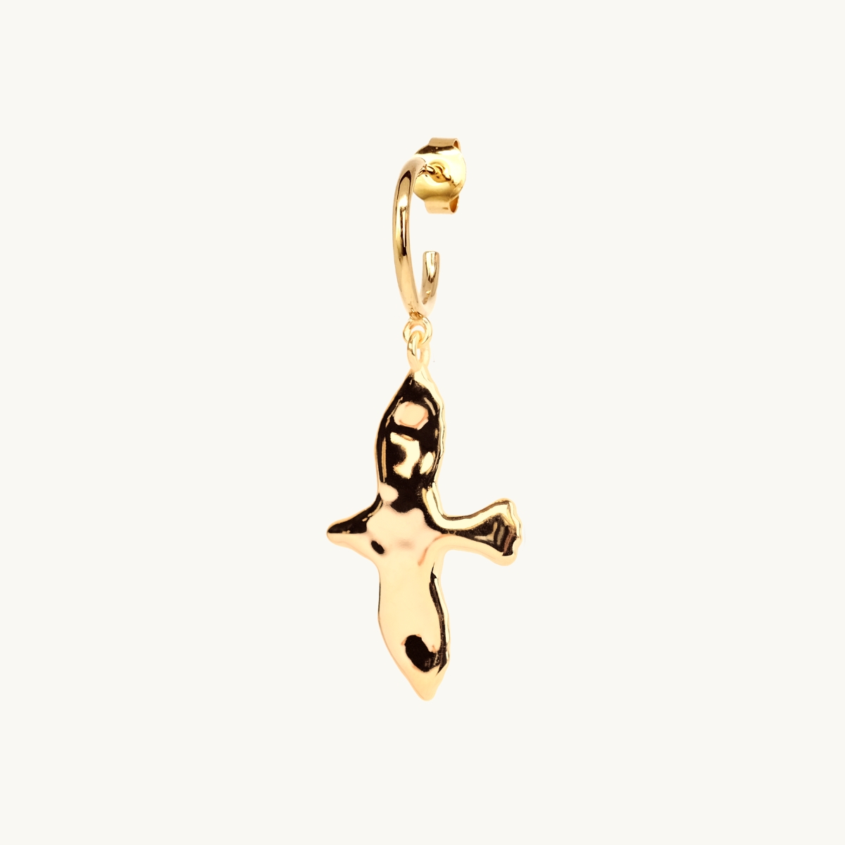 Hanging dove with an uneven surface in 18k goldplated brass