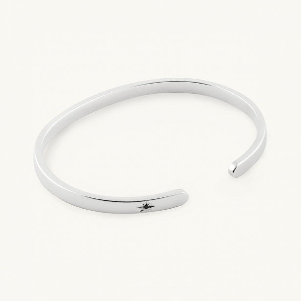 Silver bangle with a black diamond
