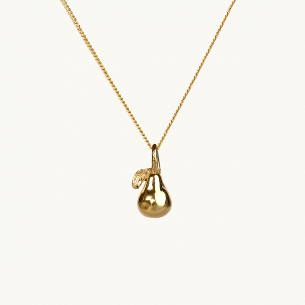 A gold necklace with a pendant in shape of a pear