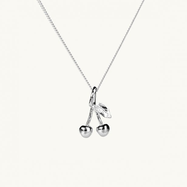 A silver necklace with a pendant in shape of two cherries