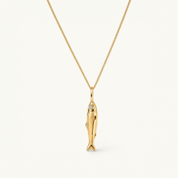 Gold necklace featuring a fish-shaped pendant with white CZ stone eyes.
