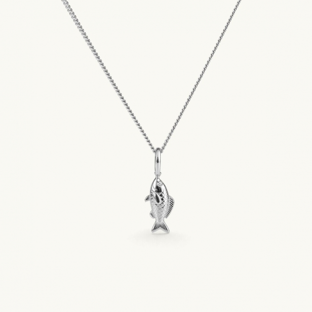 Silver necklace with a fish pendant hanging from a chain. The pendant features detailed craftsmanship that captures the fish’s shape and texture. The eyes are set with white CZ stones.