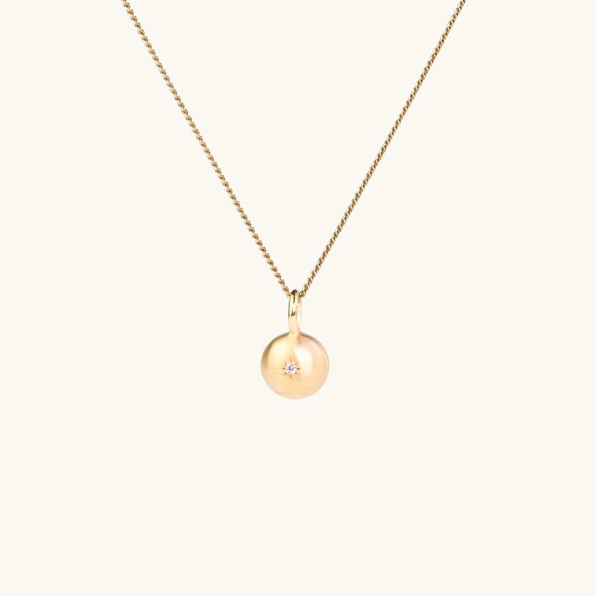 Sparkling globe necklace in gold