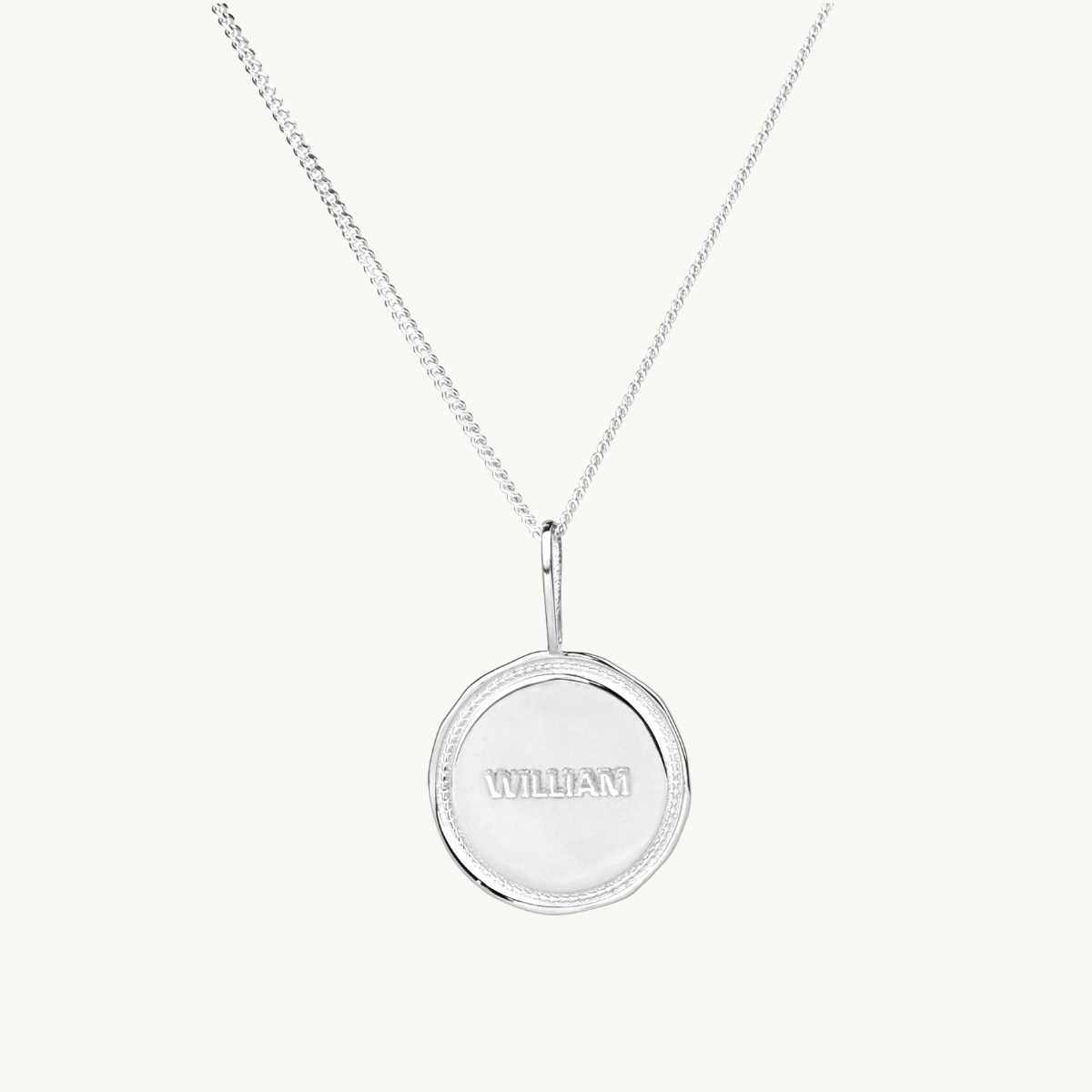 A name coin with a victory wreath in sterling silver