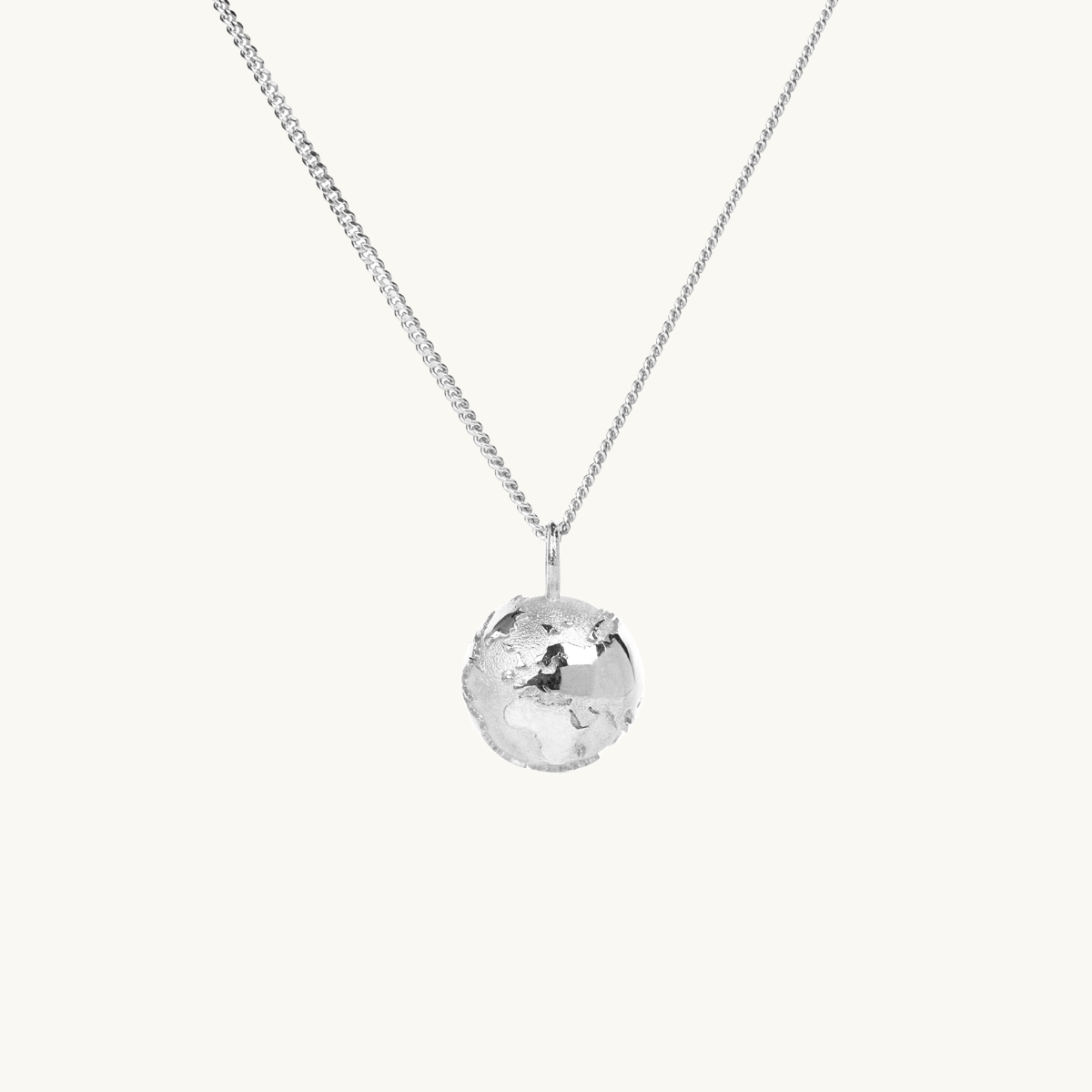 A necklace with a pendant in shape of the earth in silver