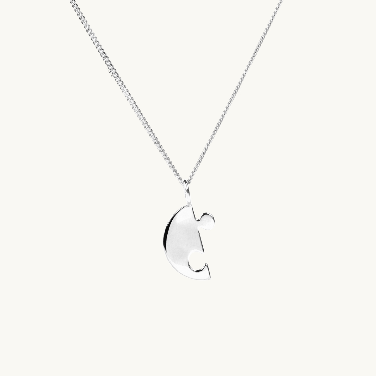 A puzzle necklace in silver