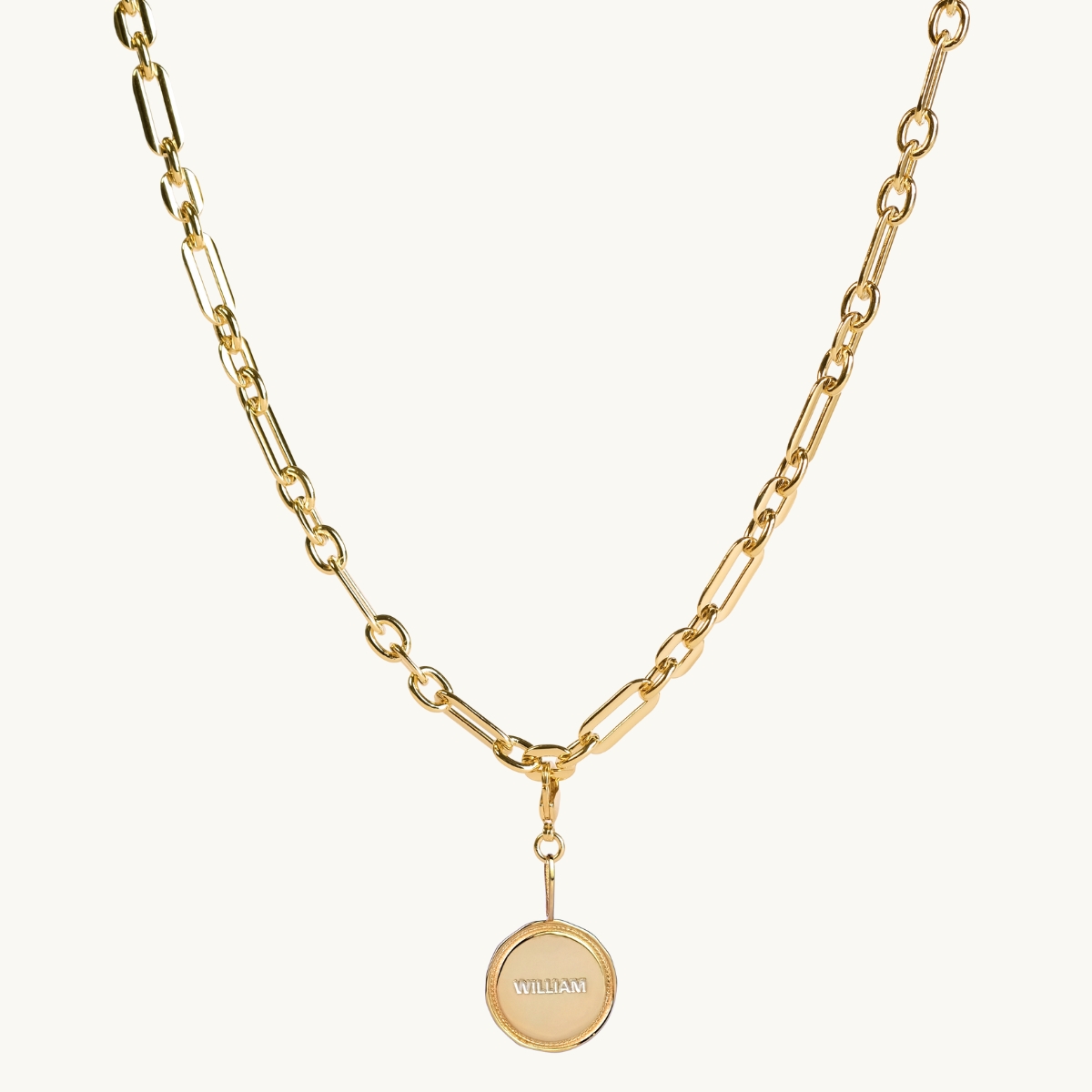 chunky chain with a wreath engraved coin in goldplated brass