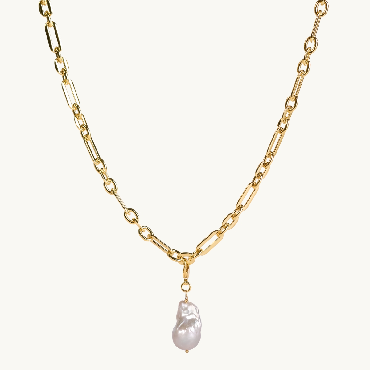 a gold chain with a freshwater pearl