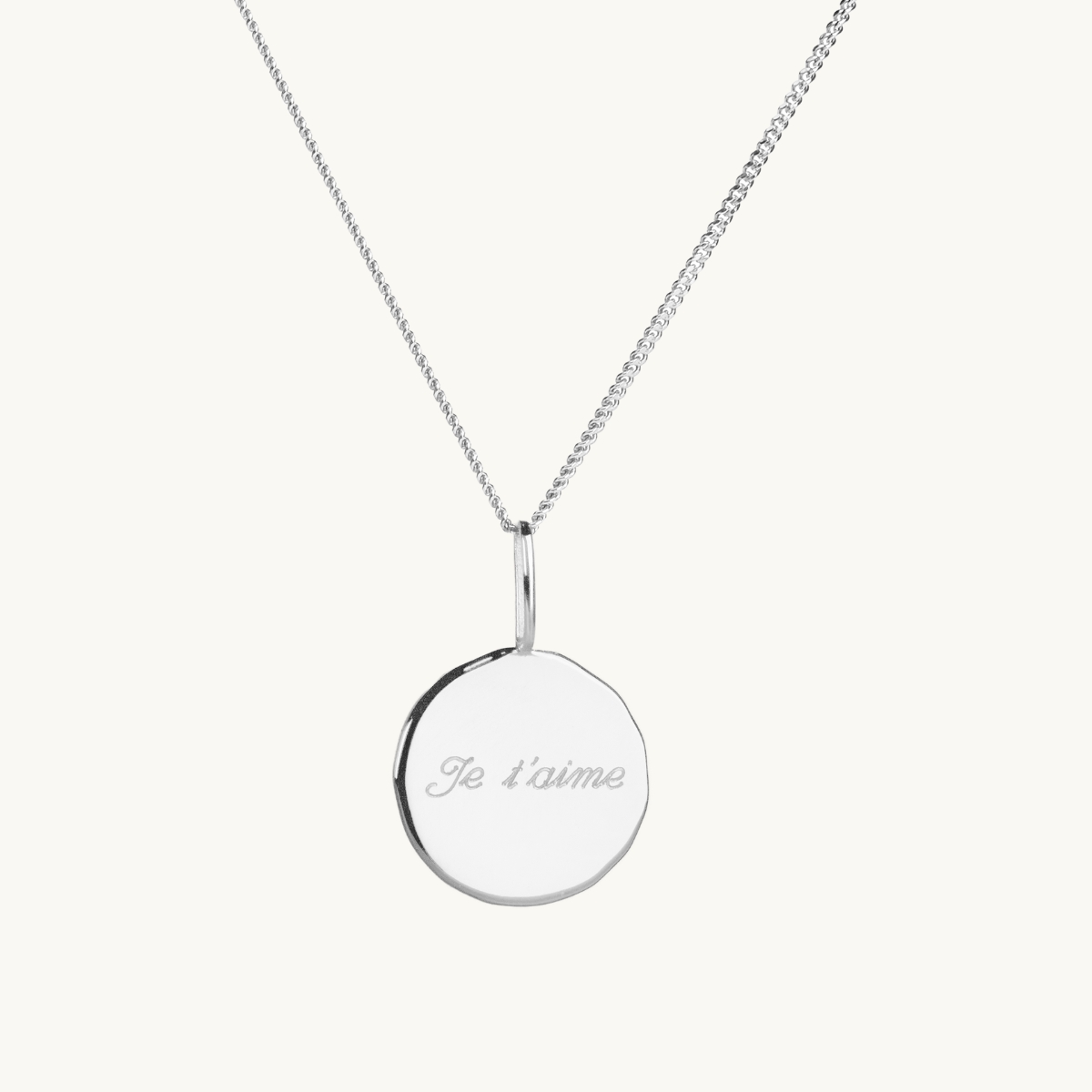 a coin in sterling silver with engraving