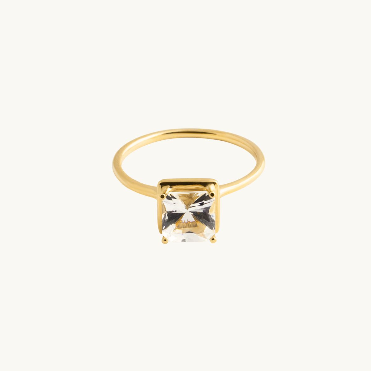 18K gold ring with a square white stone, topaz