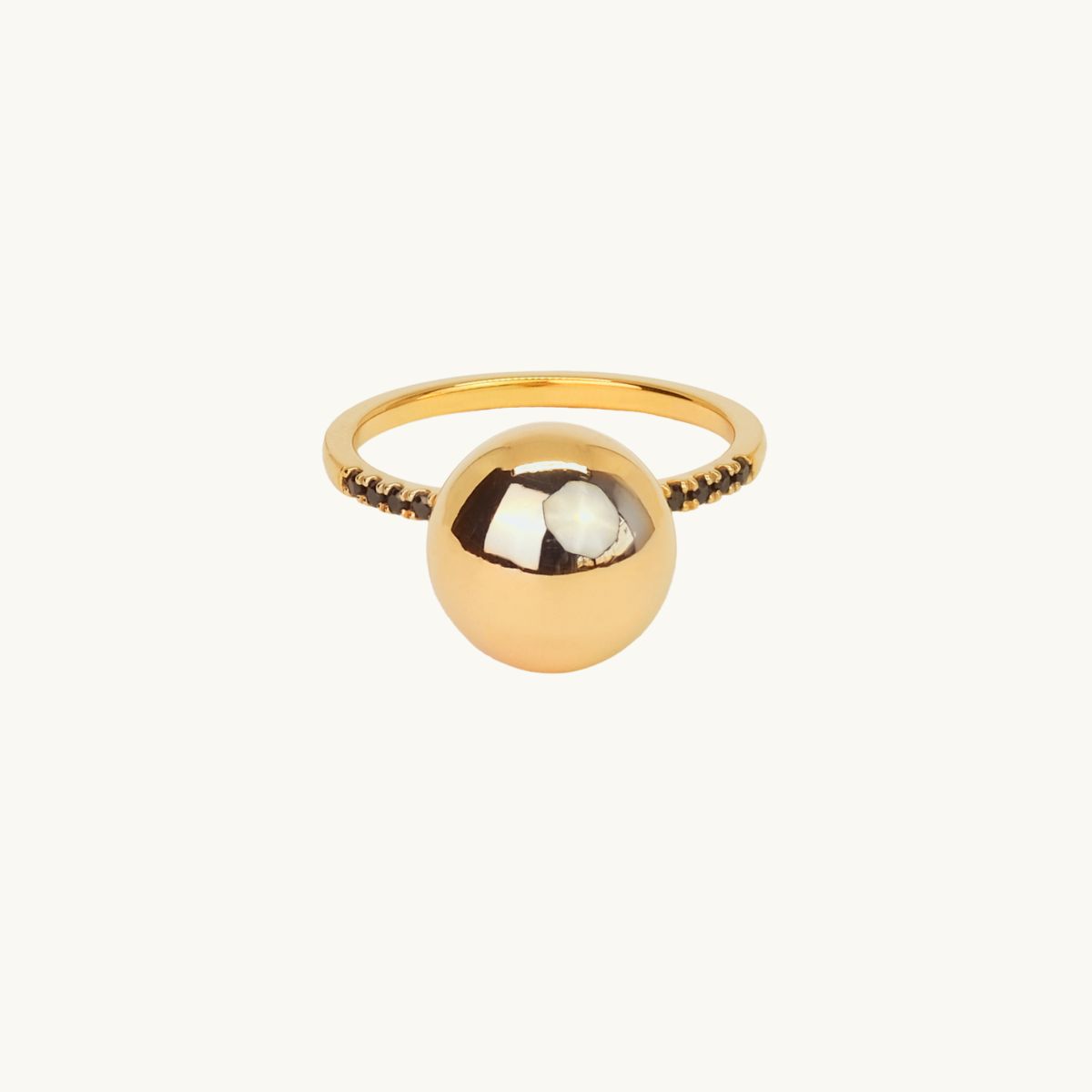 Gold plated globe ring with black cz stones