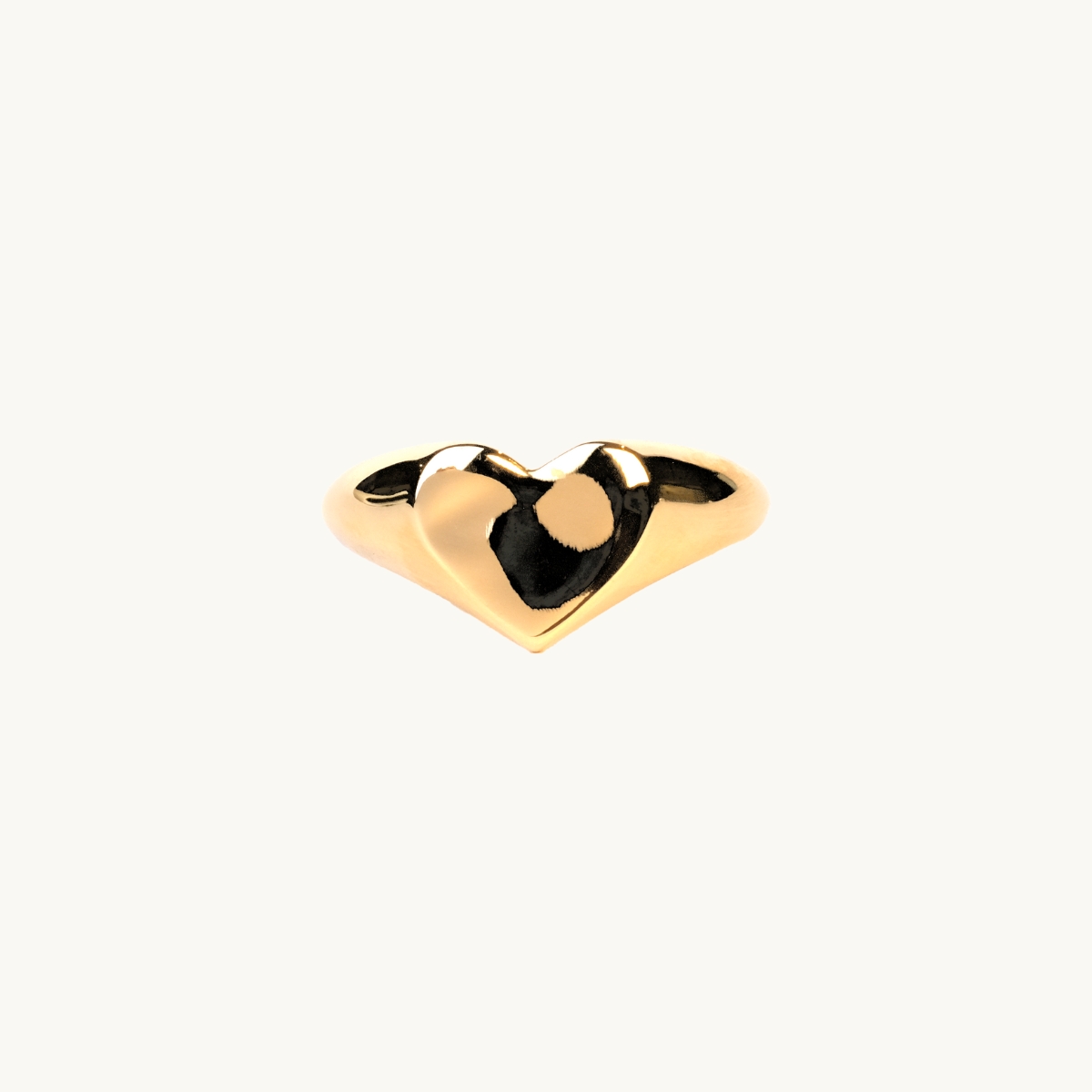 A heart ring in gold with an organic shape