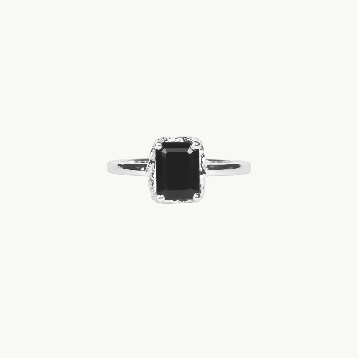 A silver ring with a rectangular black stone