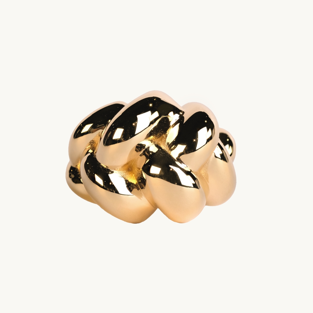 A braided ring in gold plated brass.