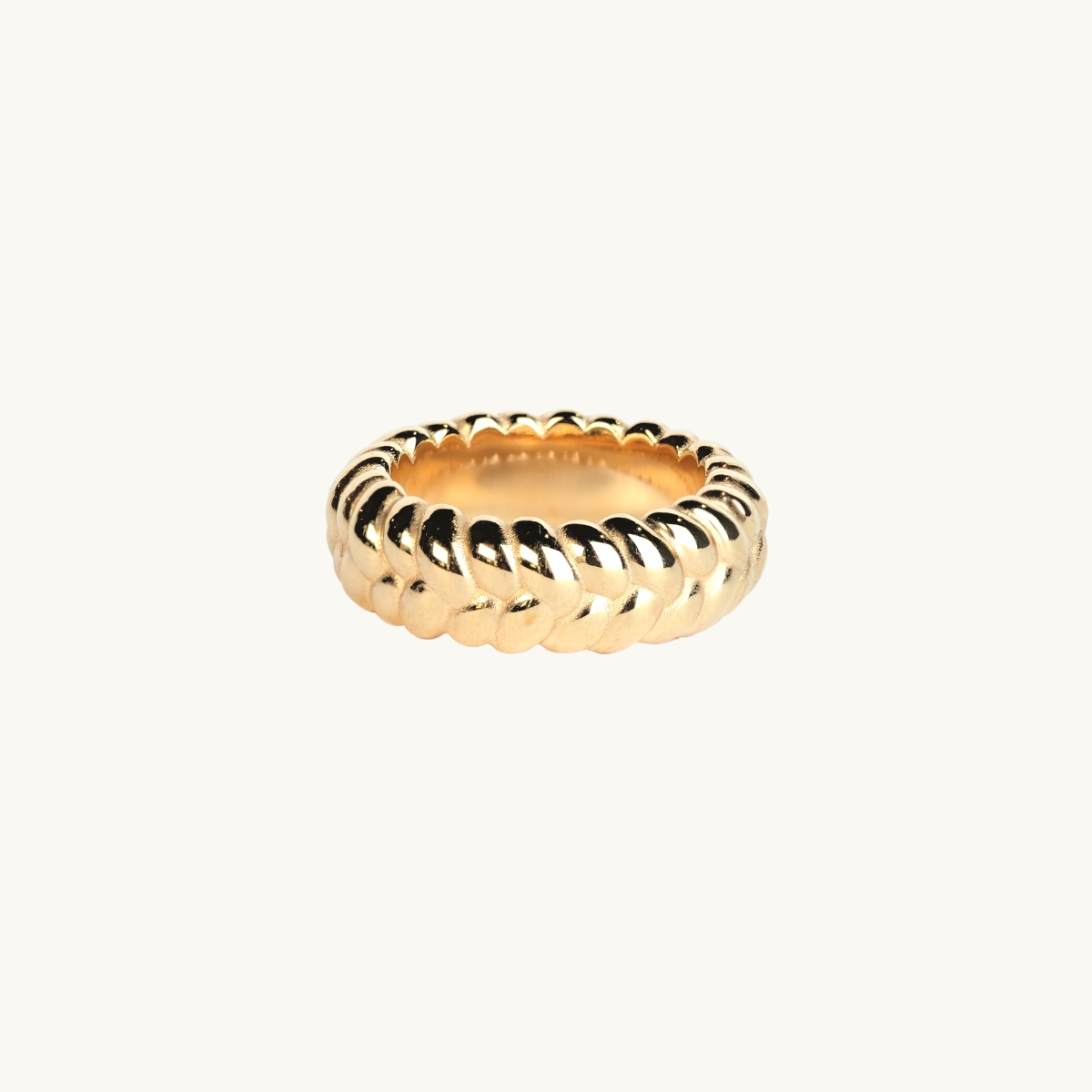 a ring in 18k goldplated brass with a braided pattern