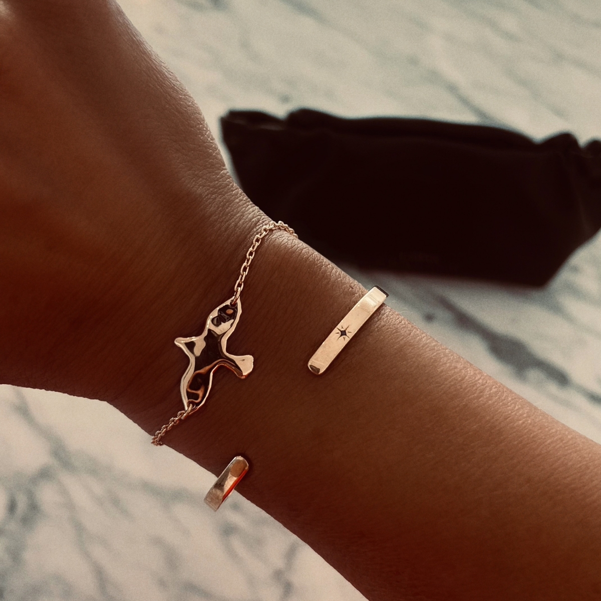 uneven dove on a bracelet in gold