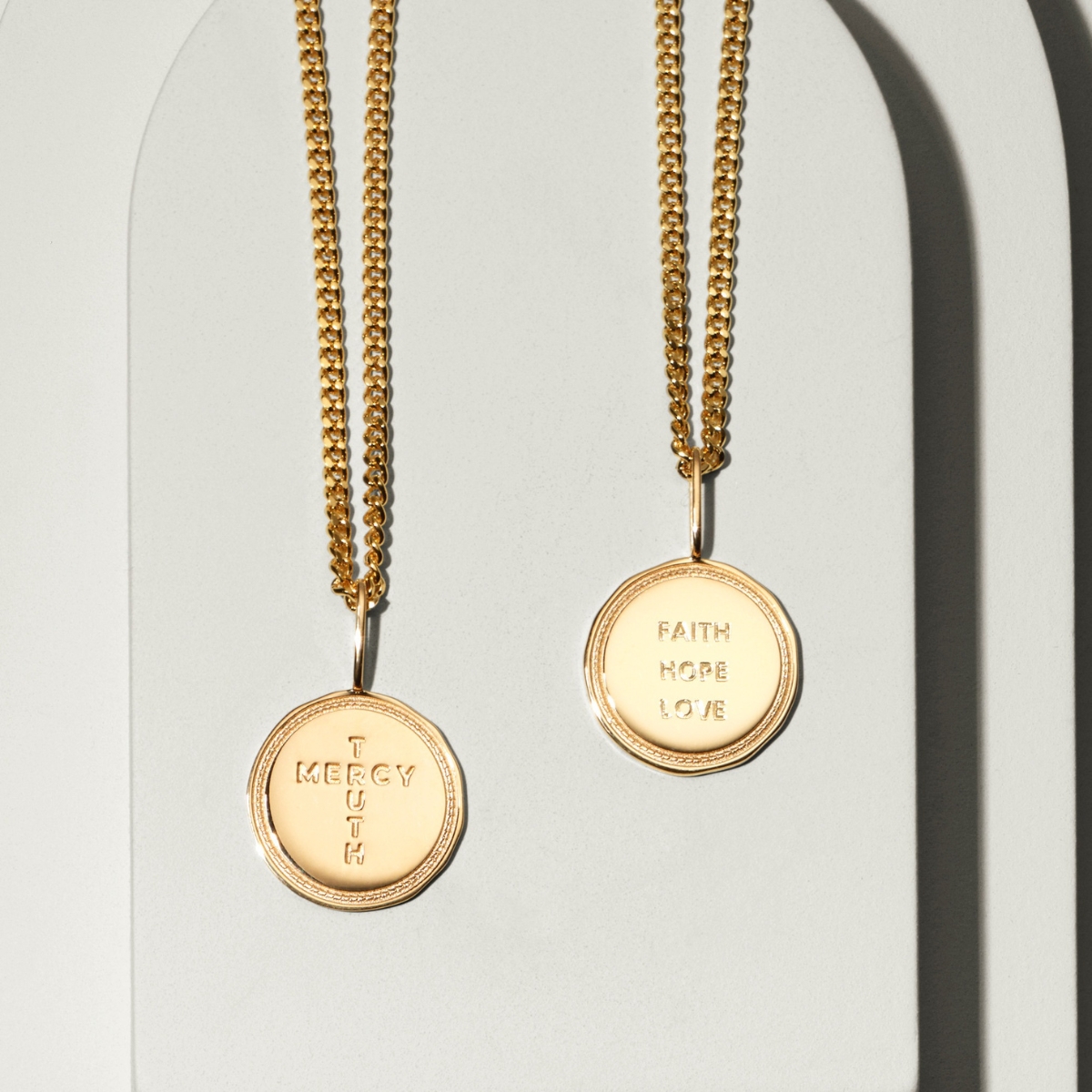 A coin in gold  with the engrave faith, true, love