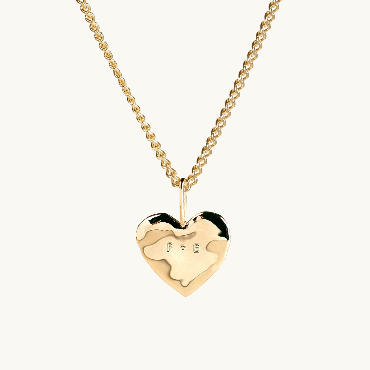 engraved gold heart with organic surface