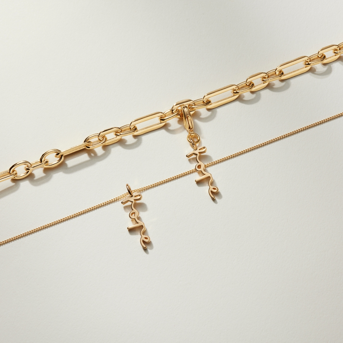 Hope on a chunky gold chain.