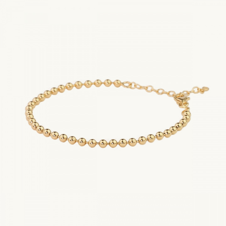 Bracelet with globes in gold plated brass