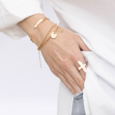 Rolex, Globe bracelet and a bangle in gold plated brass