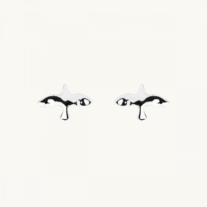 Earrings in sterlingsilver with a uneven surface in a shape of a dove