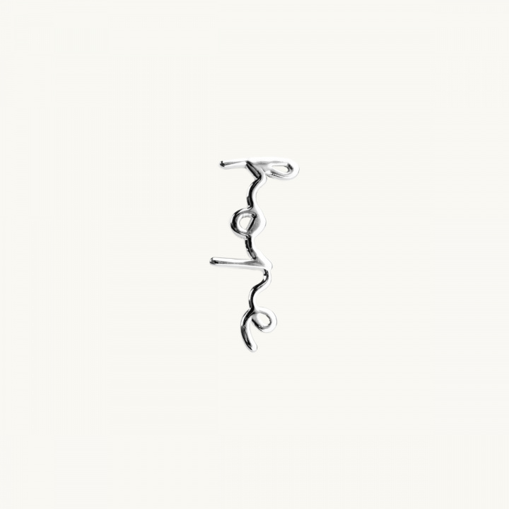silver earring with the text 