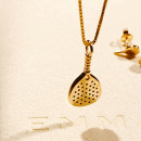 Necklace and earrings in gold in shape of a paddle rack