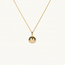 Golden globe necklace with a white stone