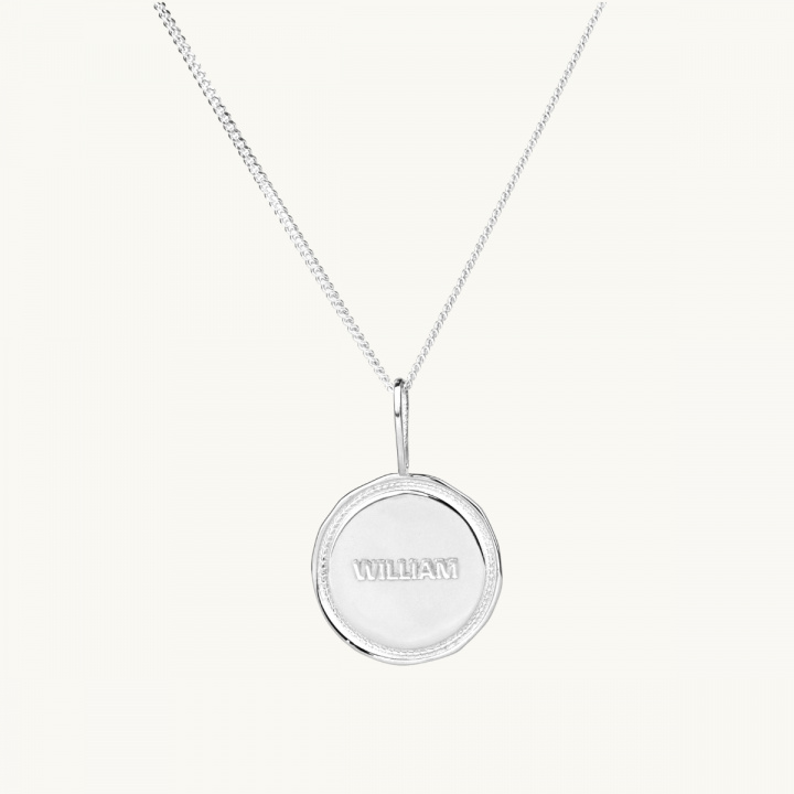 A name coin with a victory wreath in sterling silver