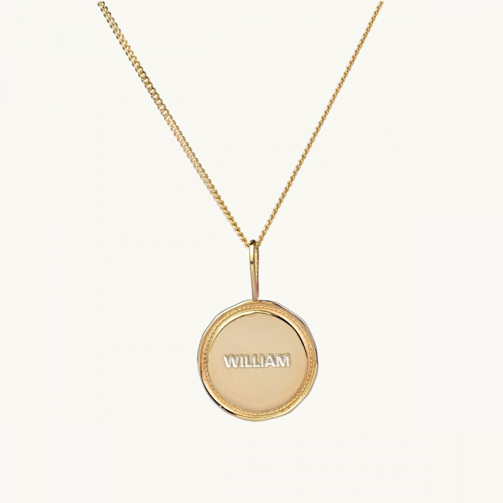 A name coin with a victory wreath in gold