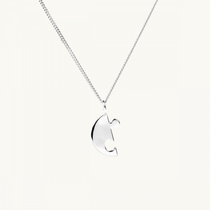 A puzzle necklace in silver