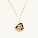 A gold coin with an organic shape and the engrave faith, hope, love