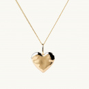 A golden heart necklace with an organic shape