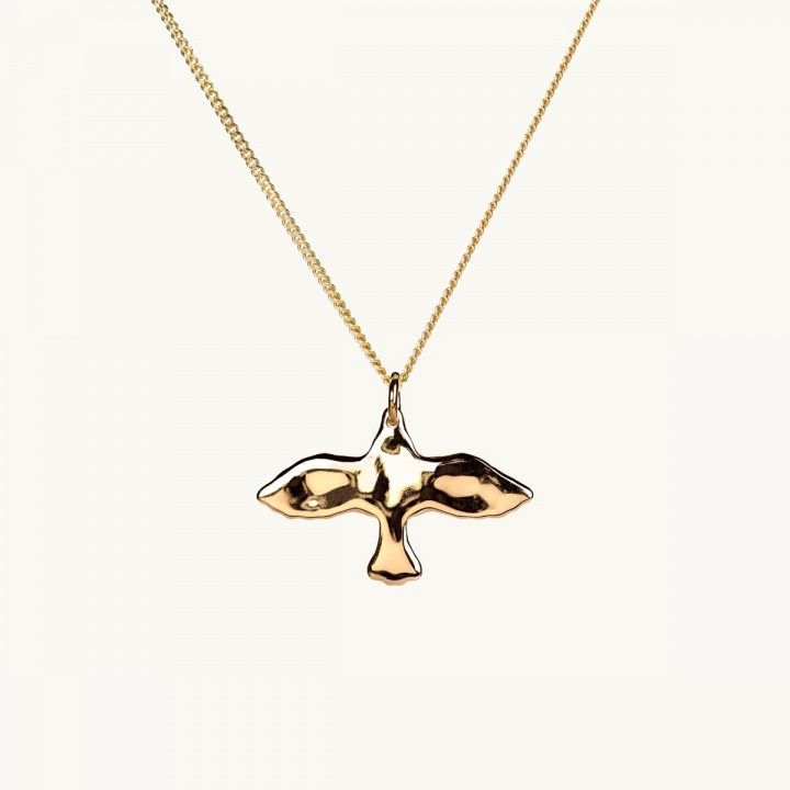 a uneven surface on a golden dove
