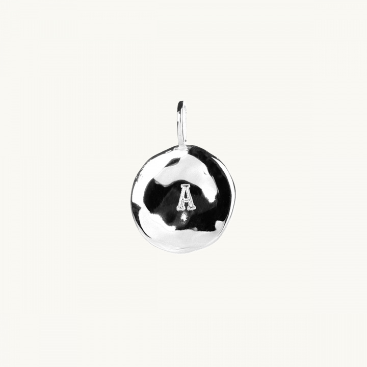 an organic letter coin in sterling silver
