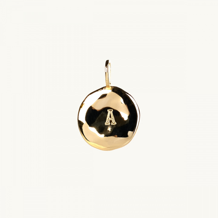 an organic letter coin in 18k gold plated brass