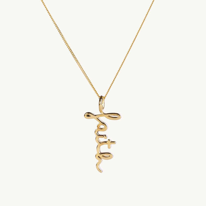 An 18K gold plated brass necklace in lowcase letters with the text faith