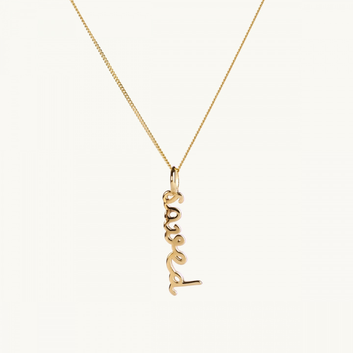 An 18K gold plated brass necklace in lowcase letters with the text Saved