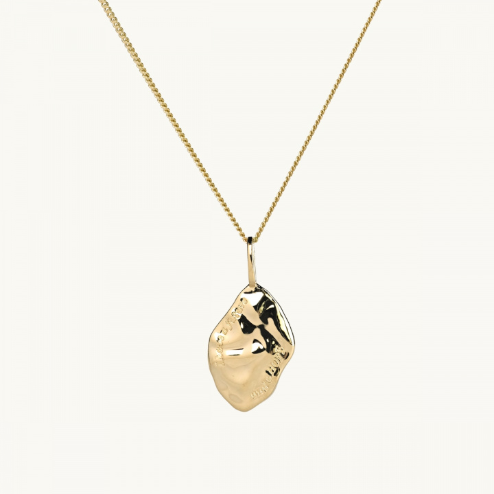 a pendant with a text about hope