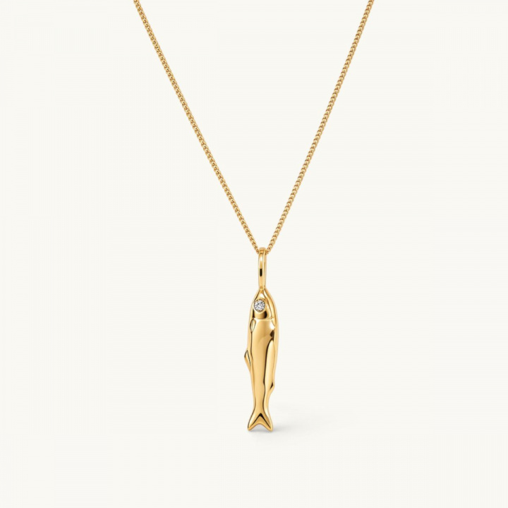 Gold necklace featuring a fish-shaped pendant with white CZ stone eyes.