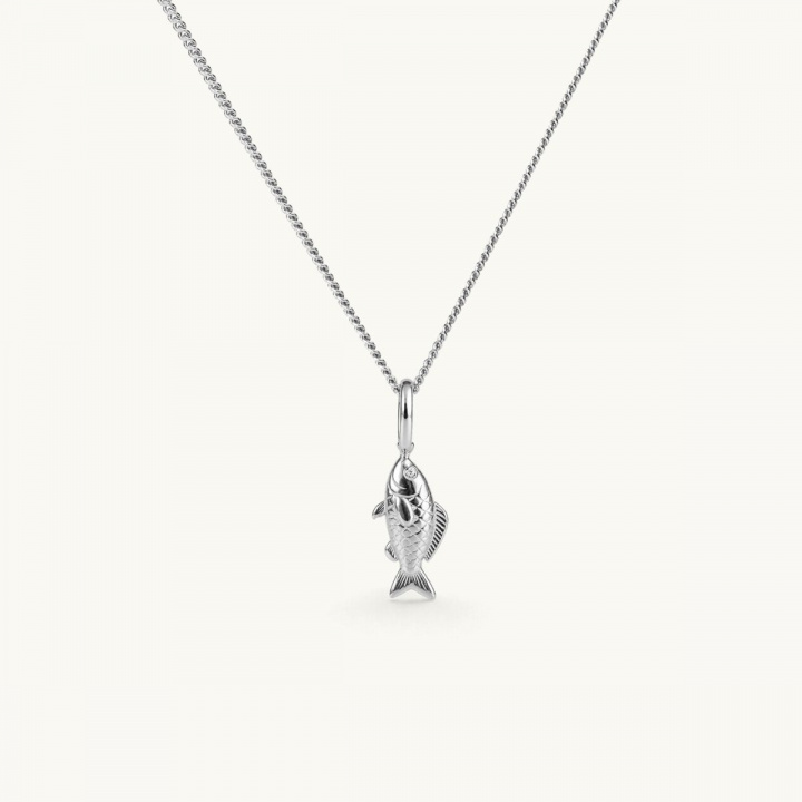 Silver necklace with a fish pendant hanging from a chain. The pendant features detailed craftsmanship that captures the fish’s shape and texture. The eyes are set with white CZ stones.