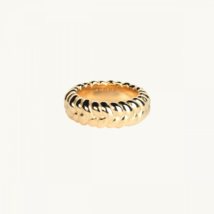 a ring in 18k goldplated brass with a braided pattern